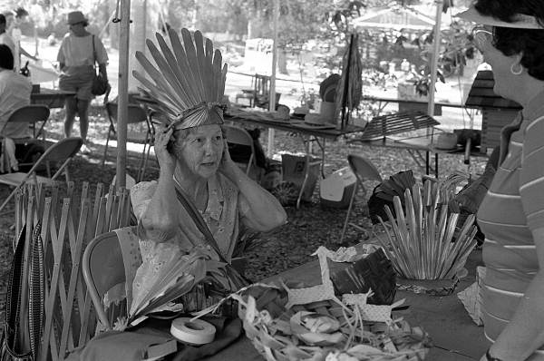 Evelyn Caffee Parks of Winter Haven showing her palmetto and palm crafts at the 1986 Florida Folk Festival - White Springs, Florida