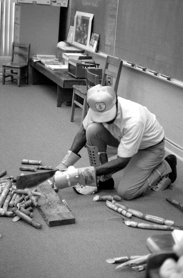 Man explaining sugarcane harvesting to class - Florida