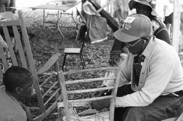 Rufus Adams demonstrating chair caning at the 1988 Florida Folk Festival - White Springs, Florida