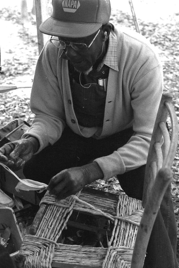 Rufus Adams demonstrating chair caning at the 1988 Florida Folk Festival - White Springs, Florida