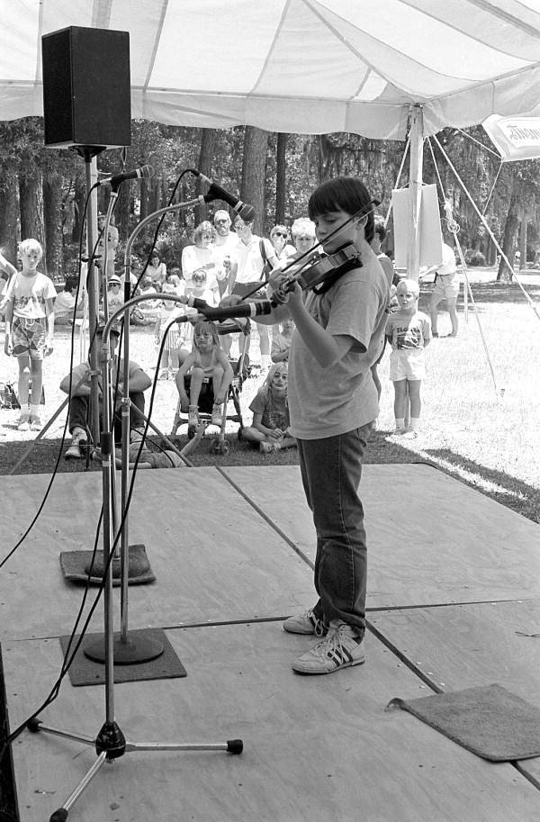 Boy competing in the Florida State Fiddlers Competition during the 1988 Florida Folk Festival - White Springs, Florida