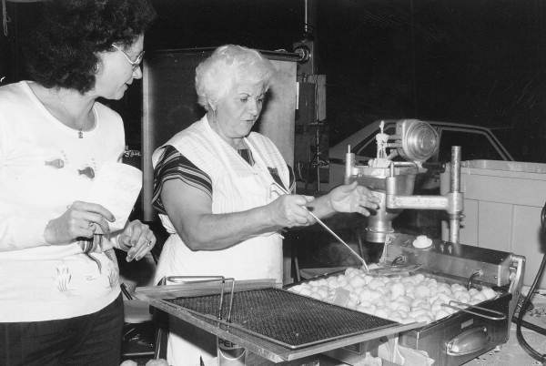 Stella Pantliodis making loukoumades during Epiphany Day celebration - Tarpon Springs, Florida