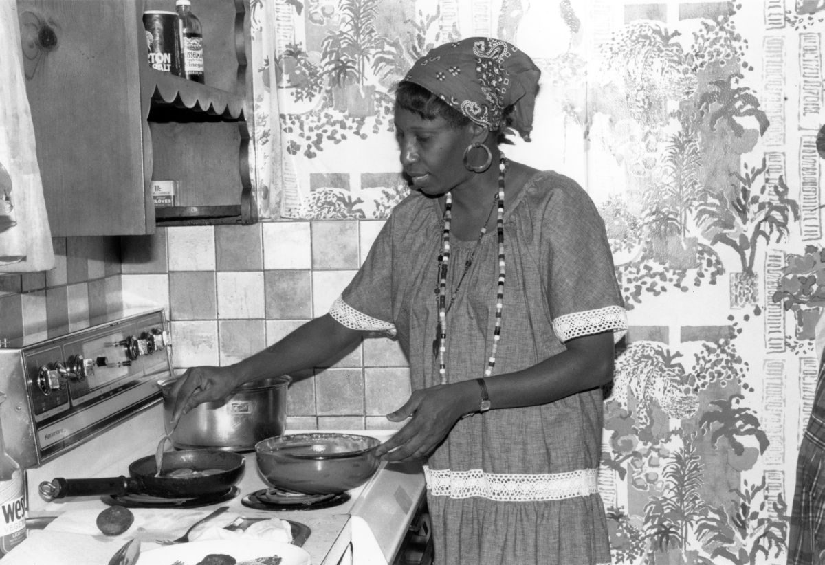 Liliane N. Louis making beignets in her Miami kitchen - Miami, Florida.