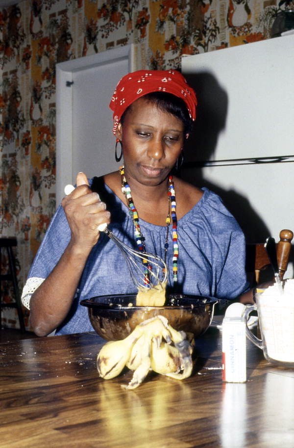 Liliane Louis mixing ingredients for beignets - Miami, Florida