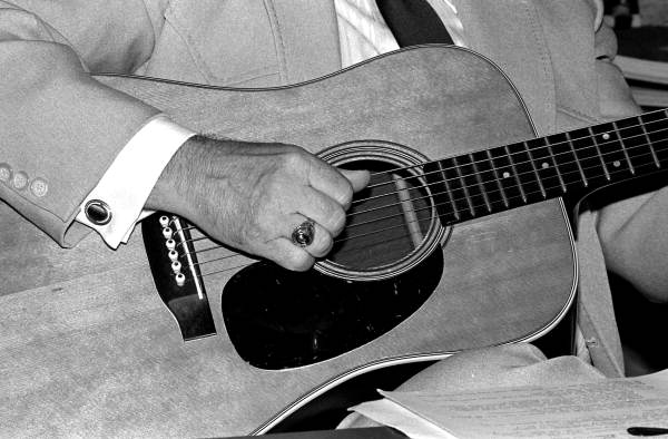 Close up view of Jim Bob Tinsley playing the guitar - Ocala, Florida.