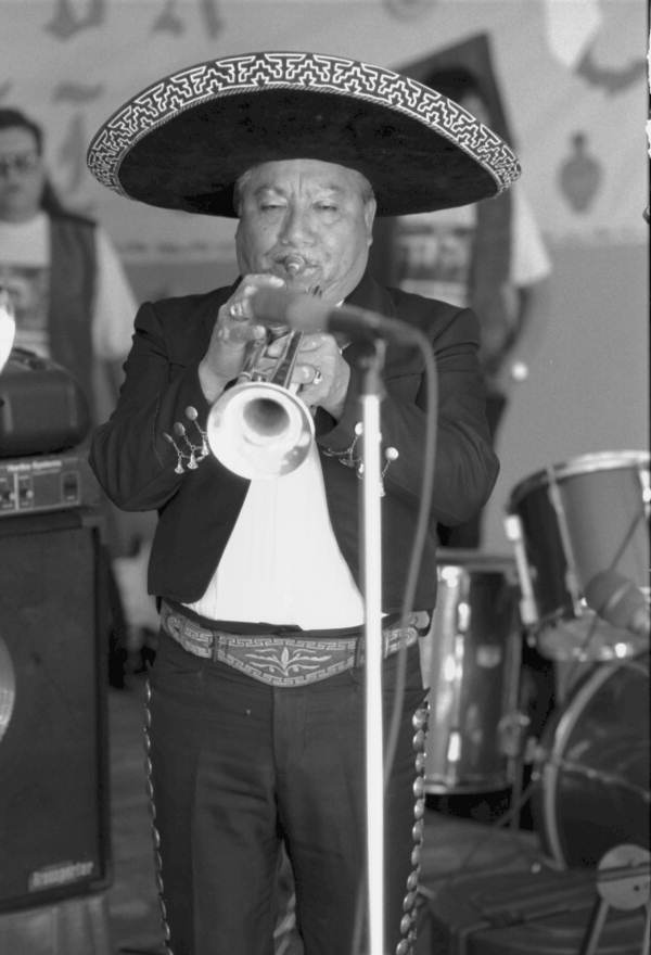 Close up of Los Mariachis de Aguilar Real's trumpet player performing at the Cinco de Mayo celebration - Immokalee, Florida