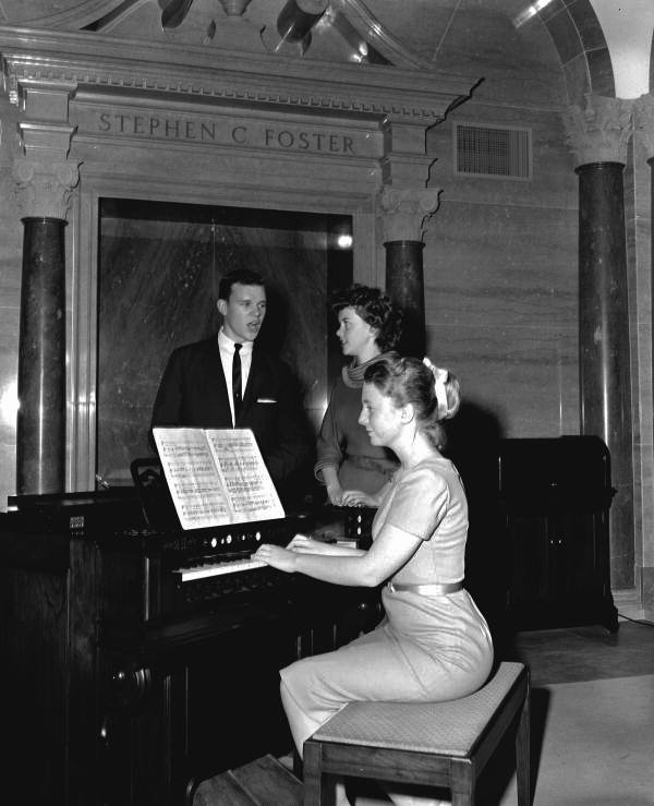 People singing to piano accompaniment during Christmas program at the Stephen Foster Center - White Springs, Florida