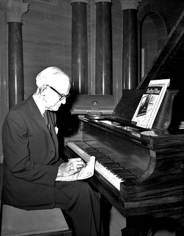 Geoffrey O'Hara writing music by piano at the Stephen Foster Center - White Springs, Florida