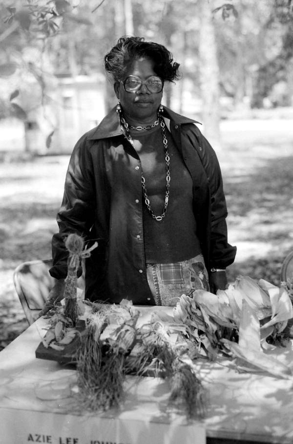 Azie Lee Johnson with root dolls: Dade County, Florida