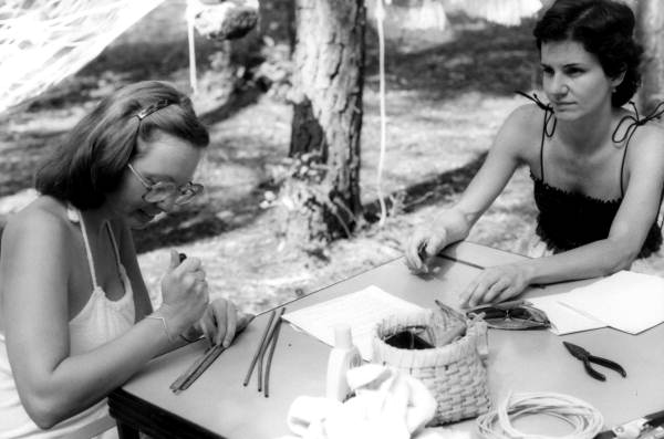 Participants in a basketry workshop making a basket at the July 4th Celebration- White Springs, Florida