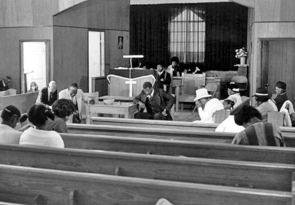 Congregation praying at Mt. Mariah Primitive Baptist Church- Lamont, Florida