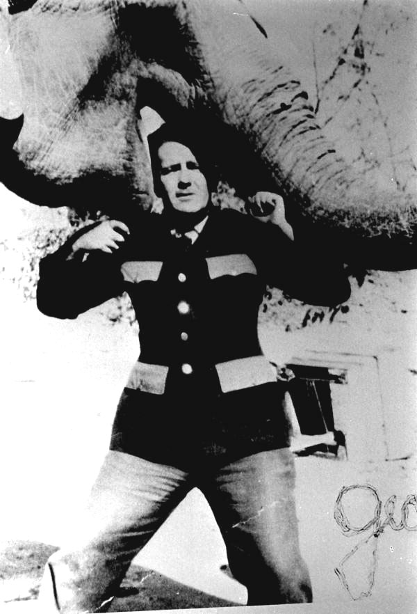 Clyde Beatty circus animal trainer with his head in an elephant's mouth