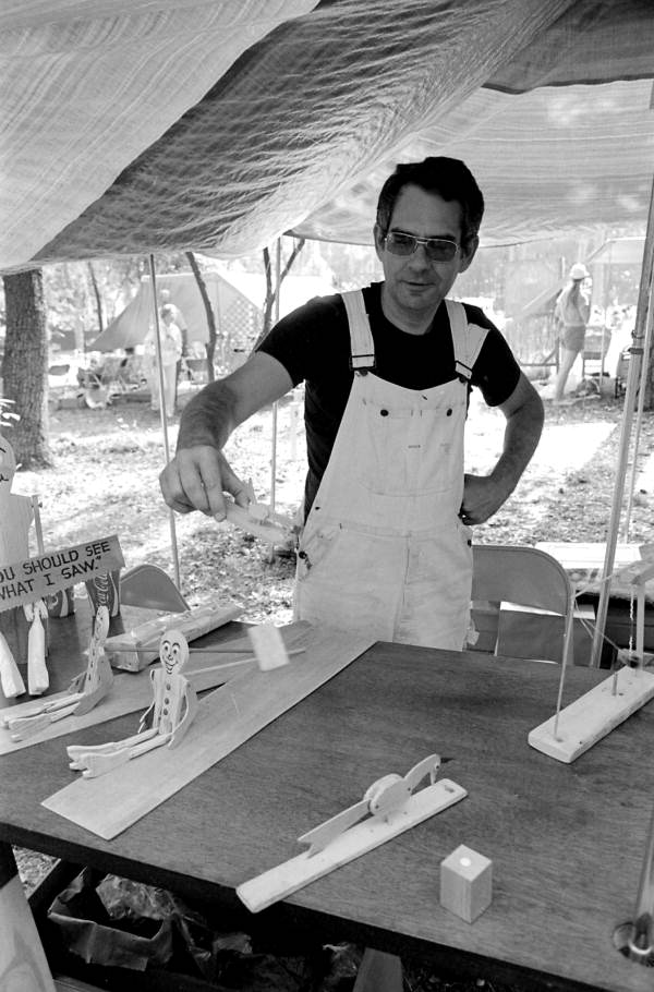 Leroy Lemay with his wooden toys at the 1983 Florida Folk Festival - White Springs, Florida