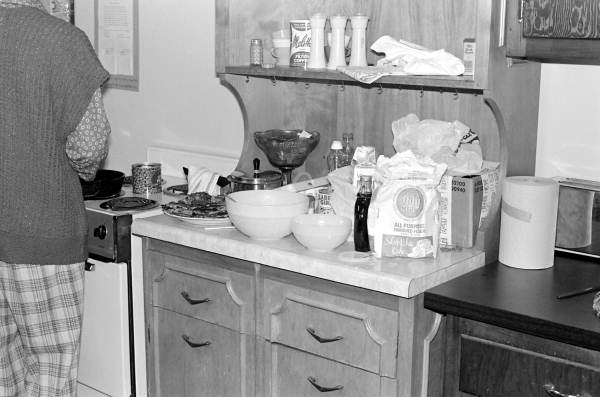 Flora Mae Hunter demonstrates cooking rice cakes.