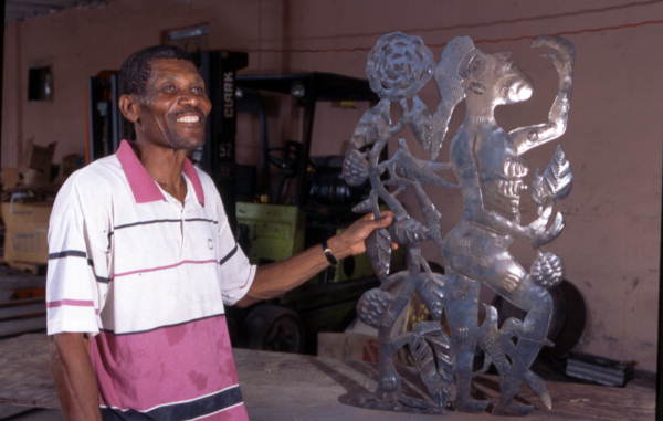Almann Ulysse with a art piece - Miami, Florida.