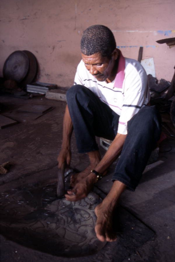 Almann Ulysee works on metal - Miami, Florida.