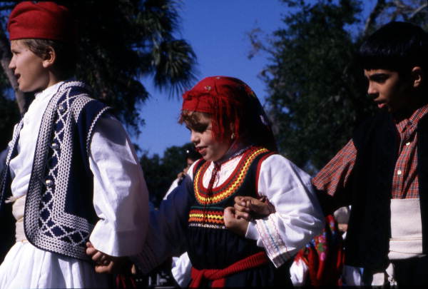 Greek American children dance in the park - Tarpon Springs, Florida.