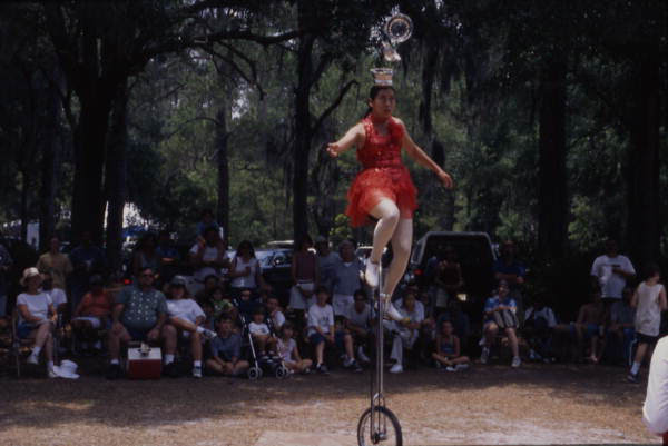 Lijun Nang, Chinese acrobat and her unicycle at the Florida Folklife Festival - White Springs, Florida.