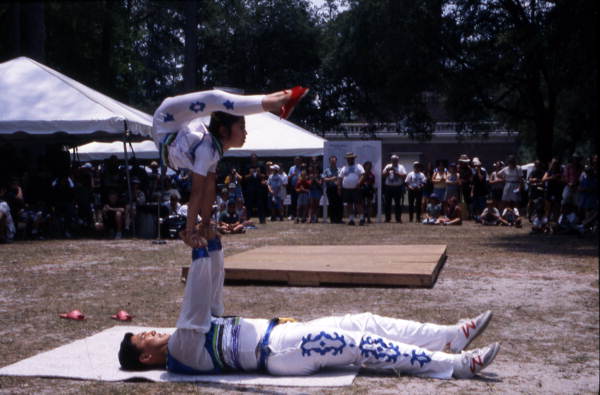 Xuefei Leng lifts Dan Dan Zhao at the Florida Folklife Festival - White Springs, Florida.