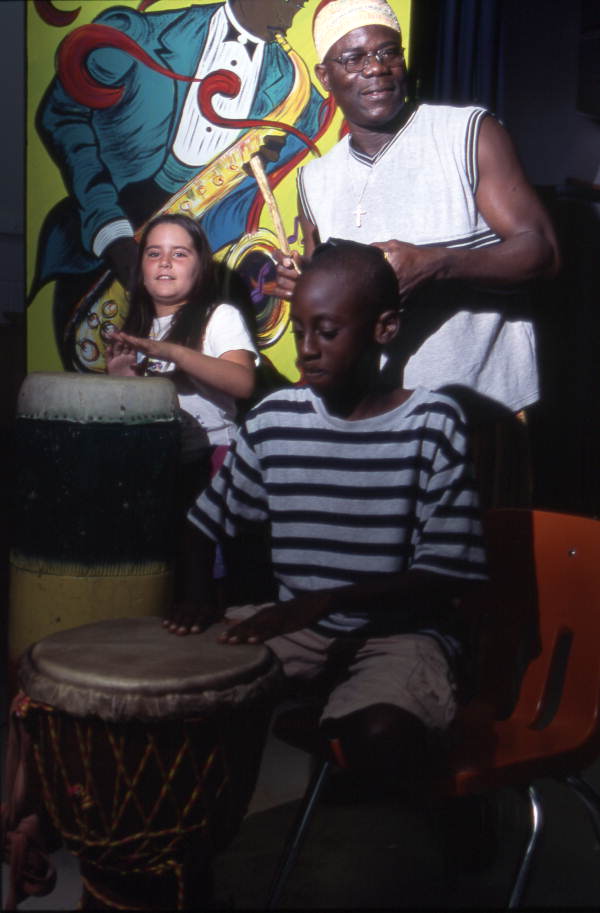 Martin Zagbo plays with children at Lake Westen Elementary School - Orlando, Florida.