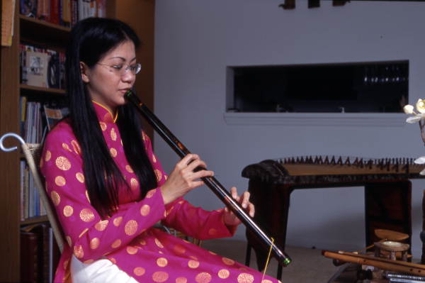 Tina Nguyen plays a musical instrument - Orlando, Florida.