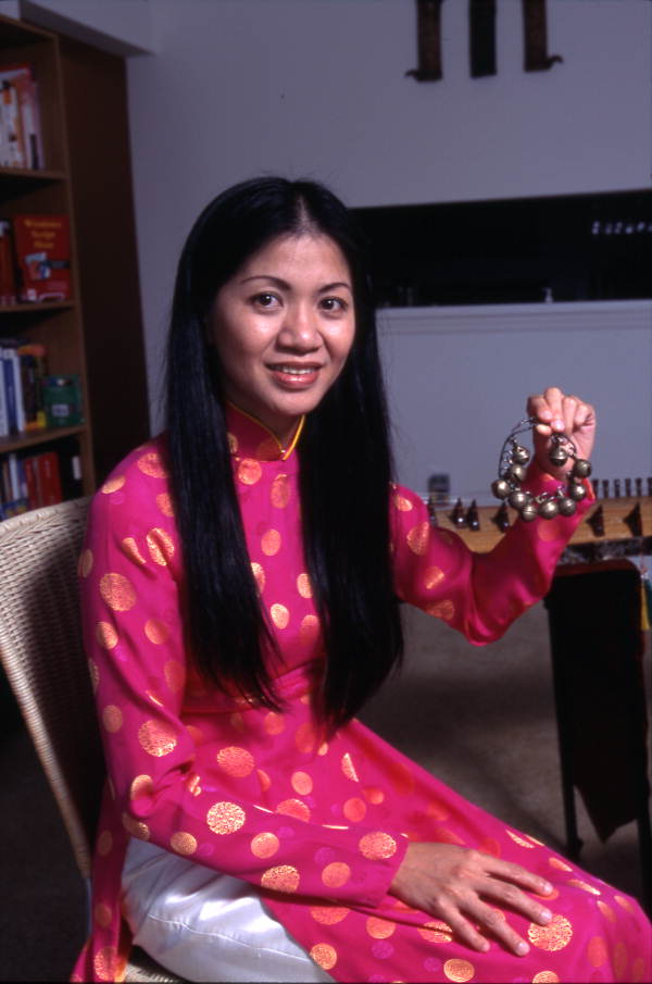 Tina Nguyen, Vietnamese musician with chimes - Orlando, Florida.