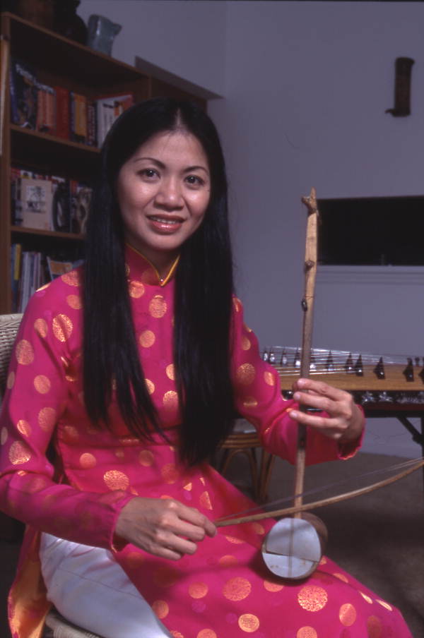 Tina Nguyen, Vietnamese musician with a musical instrument - Orlando, Florida.