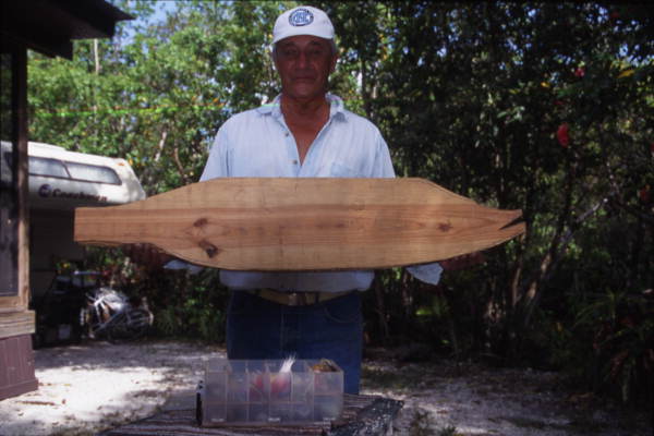 Richard Jay with a carving of a snook - Everglades City, Florida.