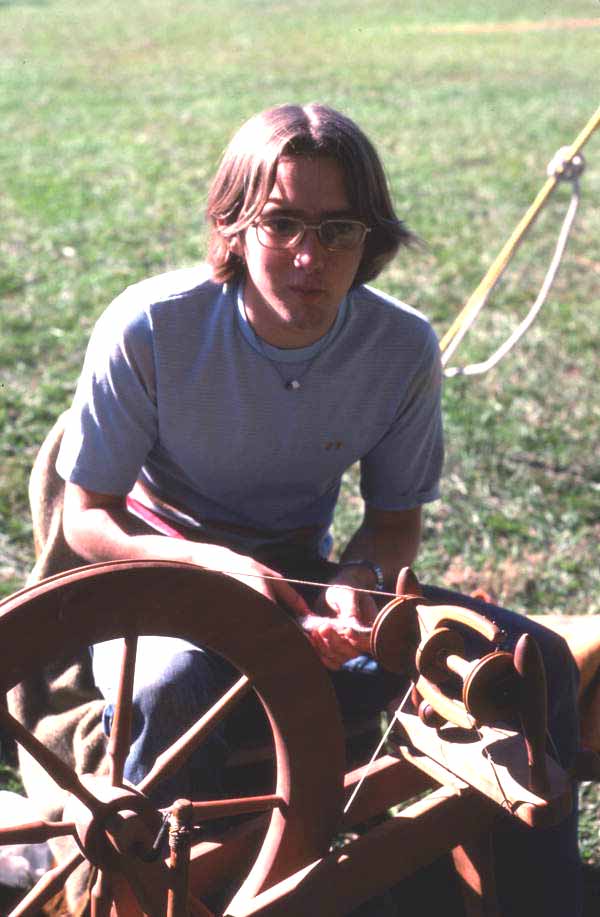 Teen using a sewing machine at Pioneer Days - Orlando, Florida.