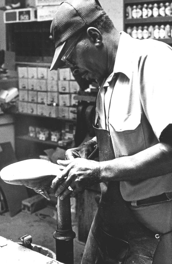 Frank Mitchell repairing a shoe at Capells Shoe Store - Lake City, Florida