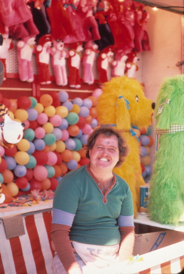 Carnival worker at his game booth