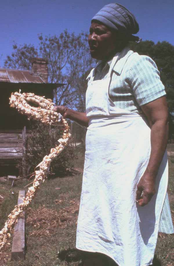 Lucreaty Clark holding a cornshuck rug she made- Lamont, Florida.