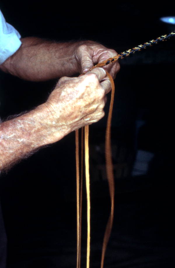 Claude Sheppard braiding a whip - Gainesville, Florida.