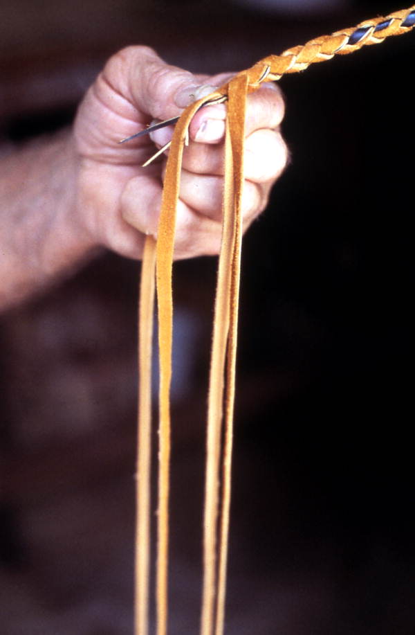 Claude Sheppard braiding a whip - Gainesville, Florida.