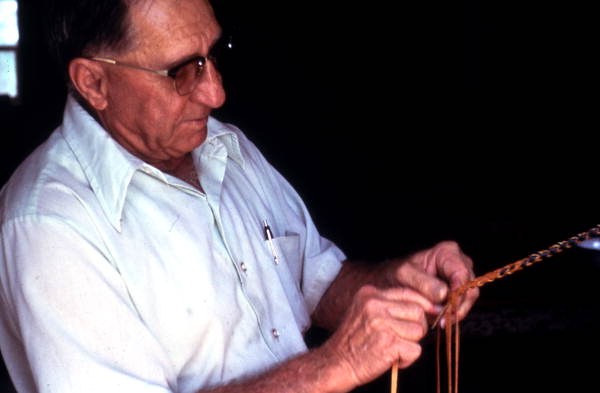 Claude Sheppard braiding a whip - Gainesville, Florida.