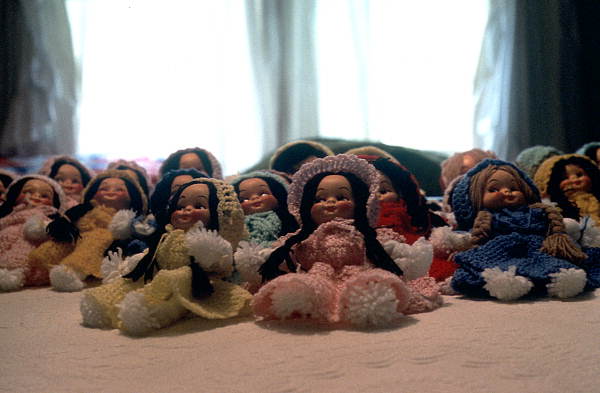Dolls with crocheted outfits