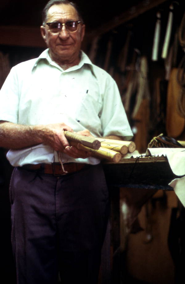 Claude Sheppard showing off handles of whips - Gainesville, Florida.