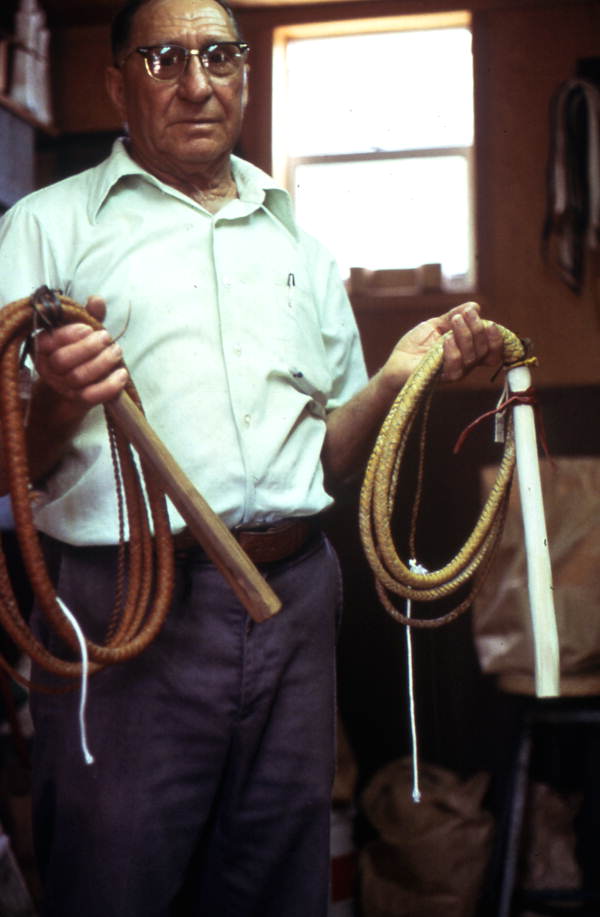 Claude Sheppard holding whips he made - Gainesville, Florida.