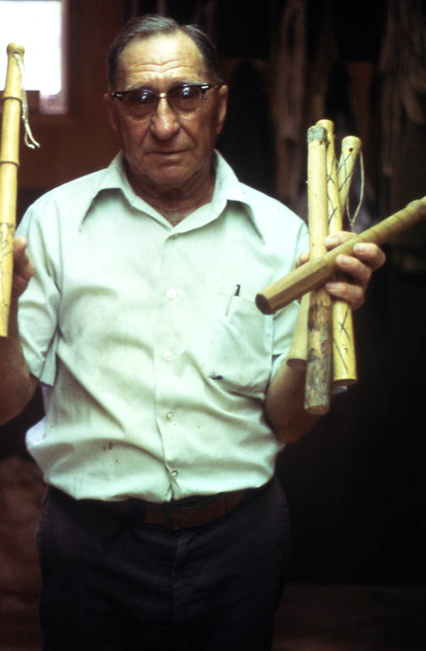 Claude Sheppard holding the handles of whips - Gainesville, Florida.