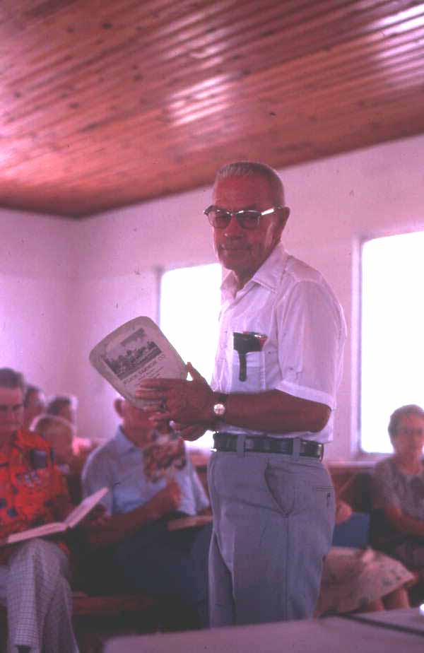 Bethlehem Primitive Baptist Church member holding fan - Old Chicora, Florida