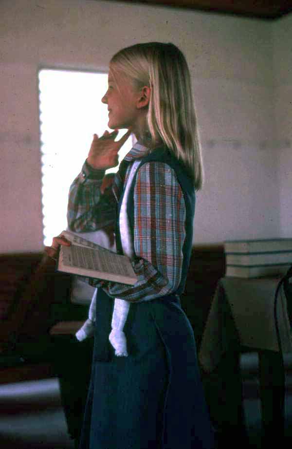 Girl singing from the Sacred Harp book at the Bethlehem Primitive Baptist Church - Old Chicora, Florida