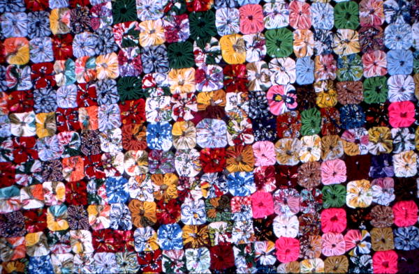Close up view of a yo-yo quilt made by Queenie Udell- White Springs, Florida