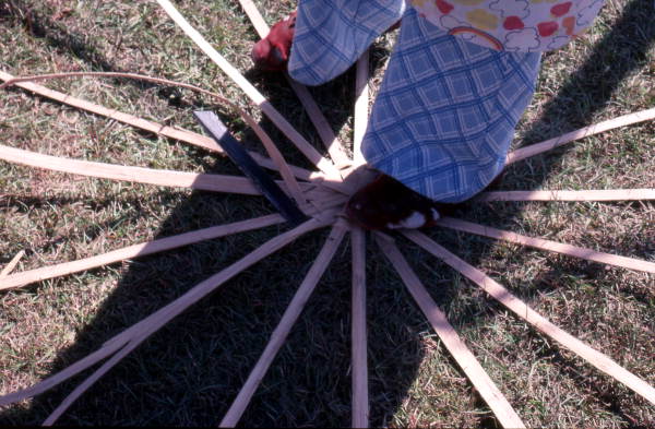 Lucreaty Clark starting to weave a white oak basket