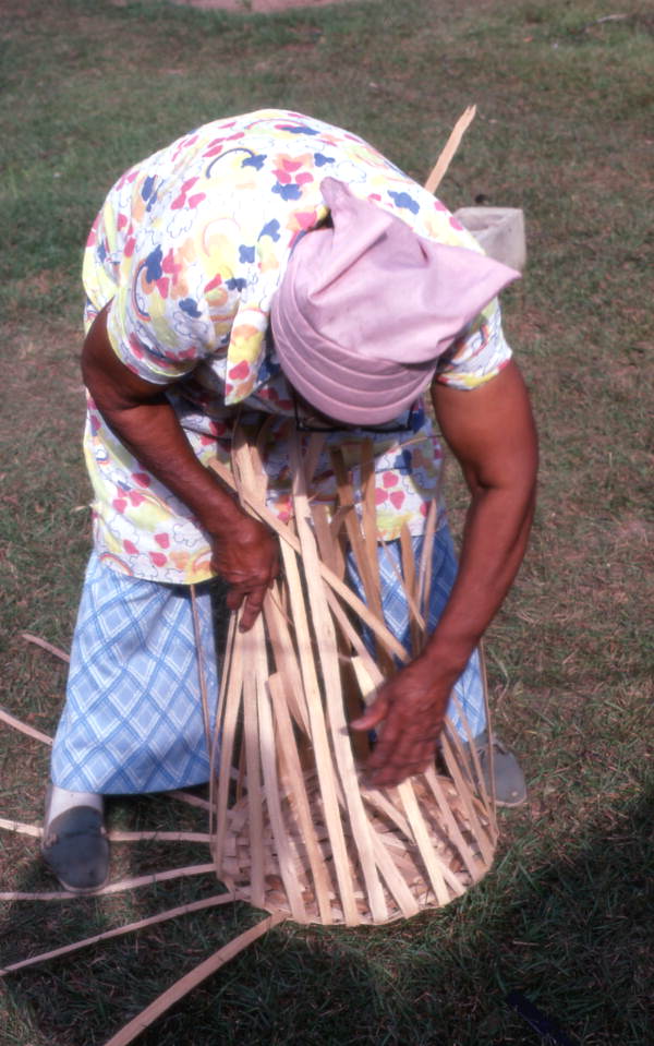 Lucreaty Clark weaving a white oak basket