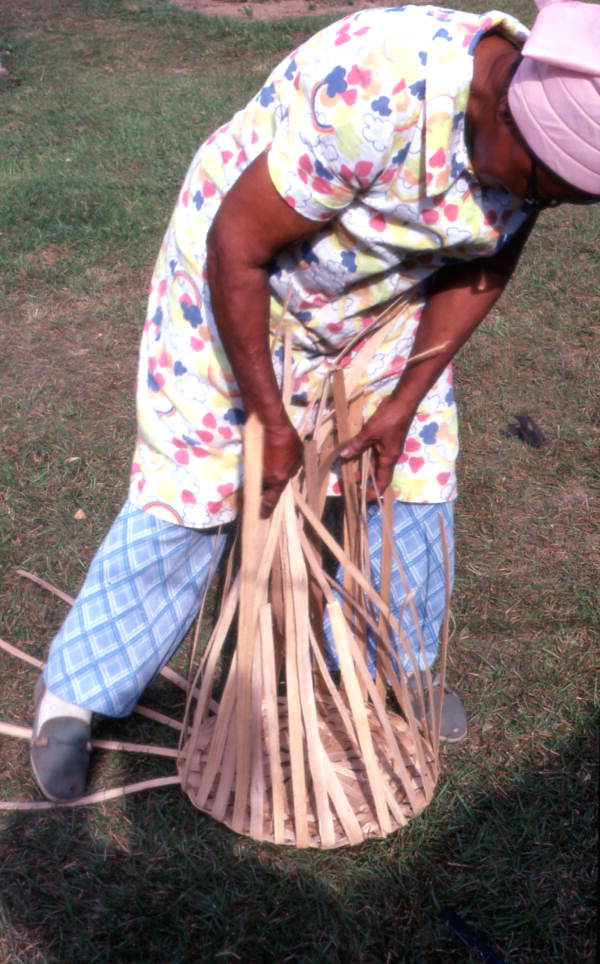 Lucreaty Clark weaving a white oak basket