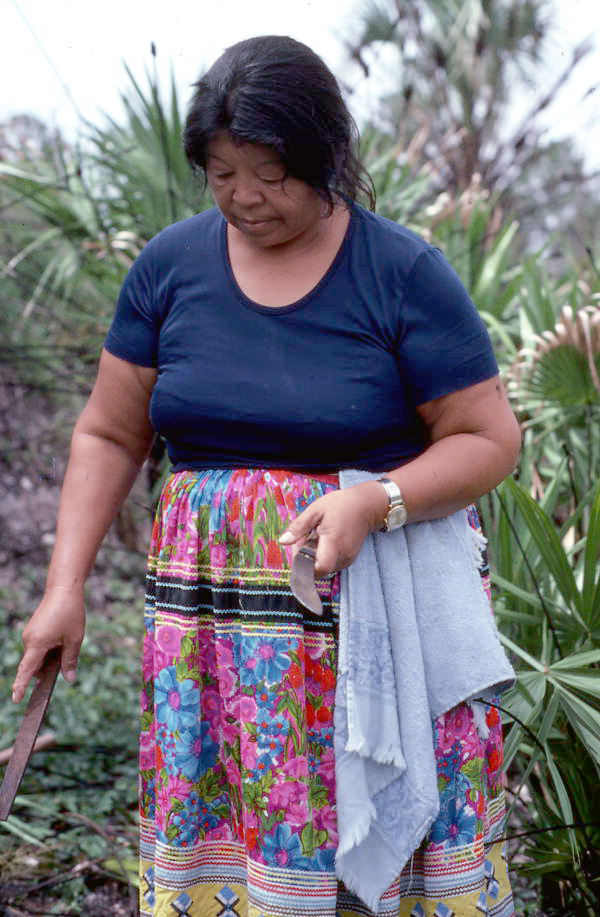 Mary B. Billie getting ready to harvest palmetto fibers for dollmaking - Big Cypress Reservation, Florida