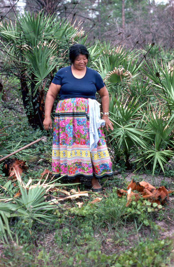 Mary B. Billie admiring the palmetto fibers she has collected for dollmaking - Big Cypress Reservation, Florida