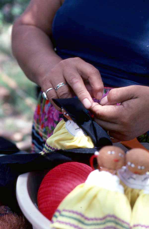 Mary Billie sewing hair on the Seminole doll she is making - Big Cypress Reservation, Florida