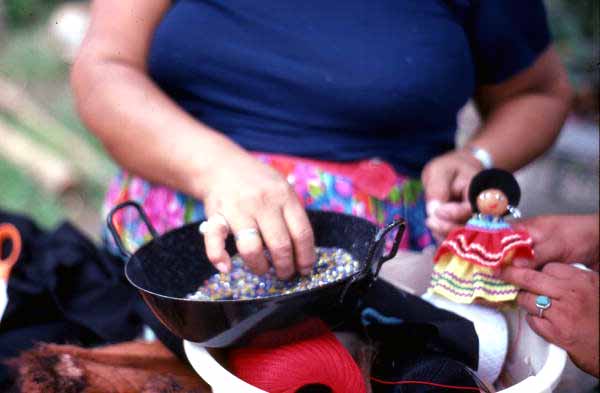 Mary Billie adding finishing touches to dolls - Big Cypress Seminole Indian Reservation