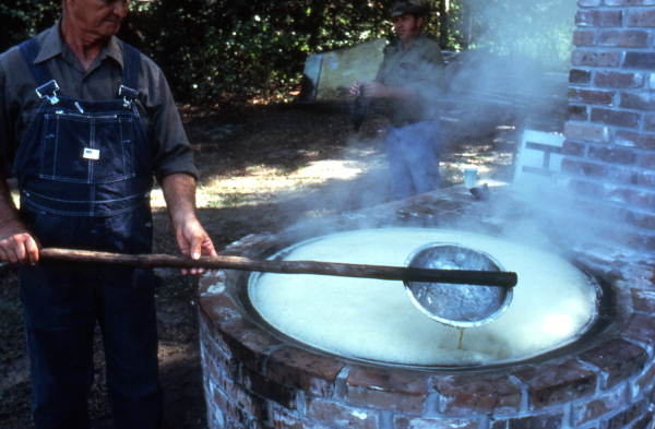 Cooking sugar cane juice into syrup - Orlando, Florida.